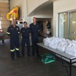 Western Cape fire fighters with their Tru-Cape apples.